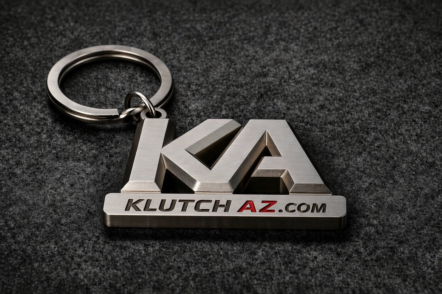 Brushed metal KA Klutchaz keychain with KLUTCHAZ.com branding